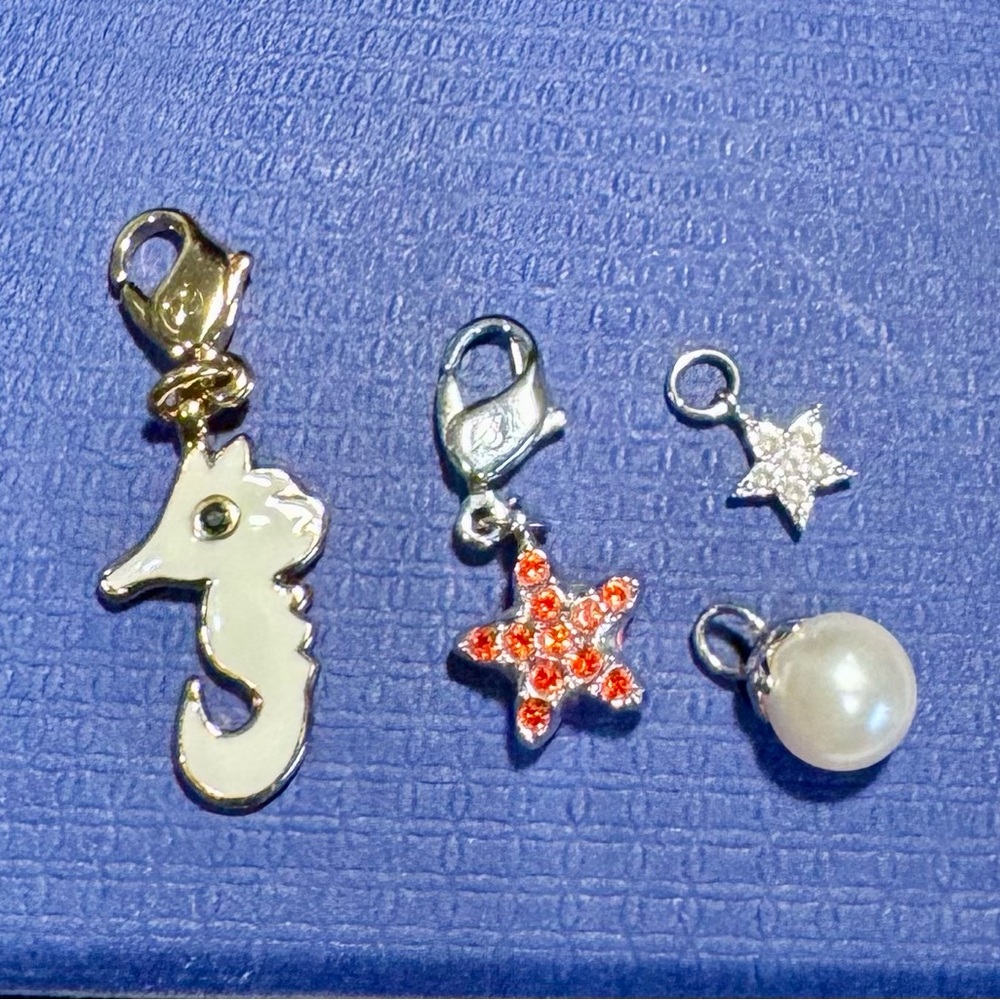 Swarovski Set of 4 Charm Clips-Seahorse, Red Star, Pearl & Star
